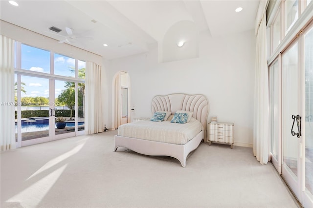 bedroom with access to exterior, light colored carpet, and ceiling fan