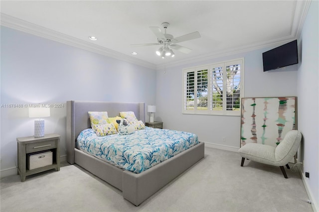 bedroom featuring ceiling fan, crown molding, and light carpet