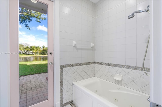 bathroom featuring a water view and tile walls