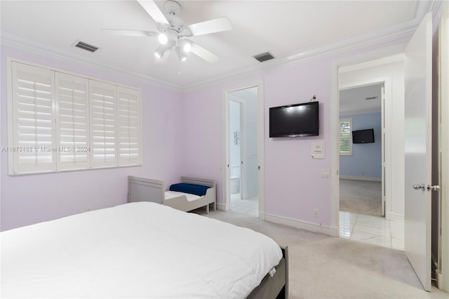 bedroom with ceiling fan, crown molding, and light colored carpet