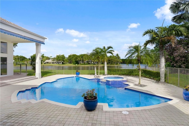 view of pool with a fenced backyard, a patio, a water view, and a pool with connected hot tub