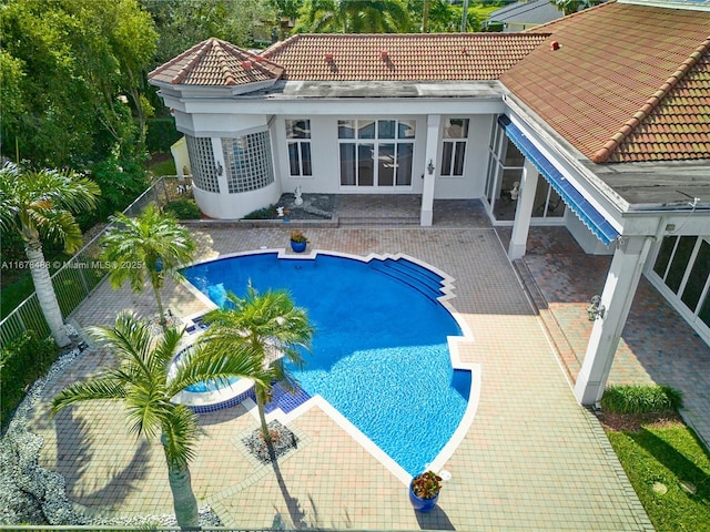 view of swimming pool with a fenced in pool, a fenced backyard, and a patio area