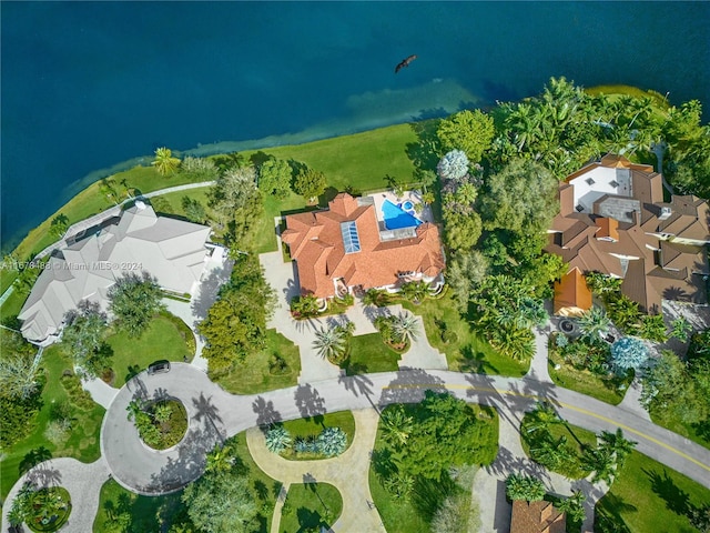 birds eye view of property with a water view