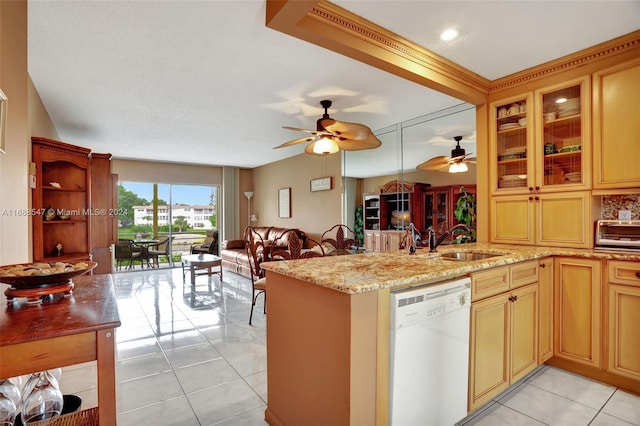 kitchen featuring sink, light tile patterned floors, kitchen peninsula, dishwasher, and light stone counters