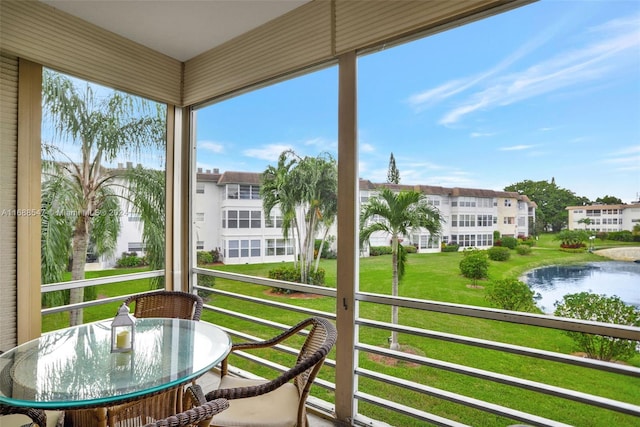 balcony featuring a water view