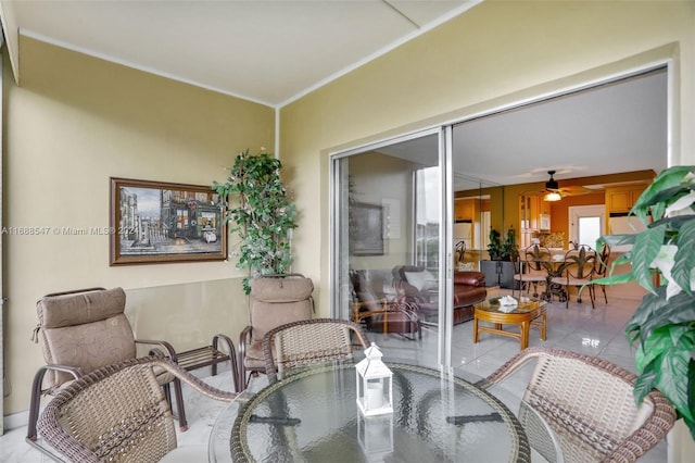 dining area featuring ceiling fan and light tile patterned floors