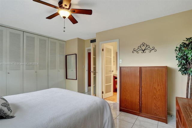 tiled bedroom with ceiling fan