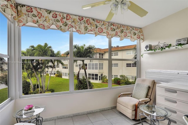 sunroom with ceiling fan and plenty of natural light