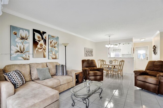 3501 NW 47th Ave Unit 515, Lauderdale Lakes, FL 33319 - living area with crown molding, a chandelier, and light tile patterned floors