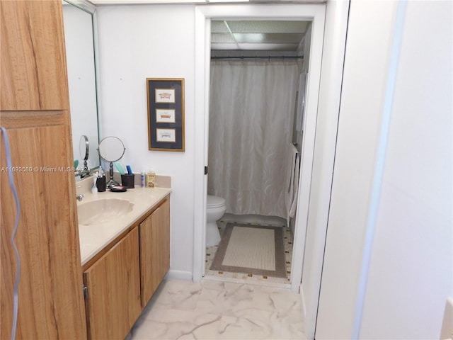 bathroom featuring vanity and toilet