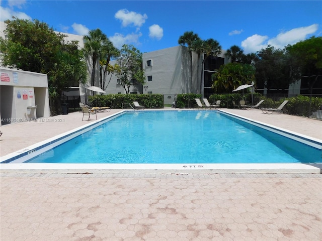 view of swimming pool featuring a patio