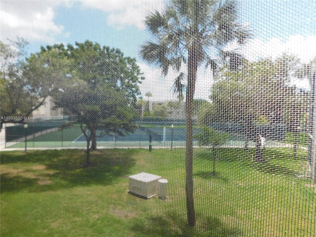 view of yard featuring tennis court