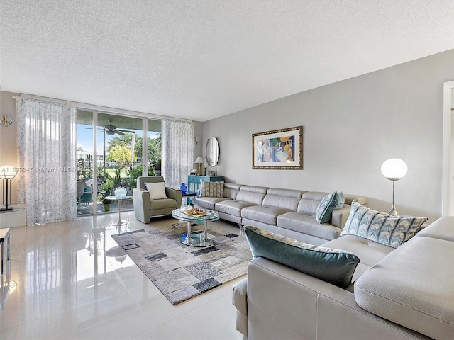 living room with tile patterned floors and a textured ceiling