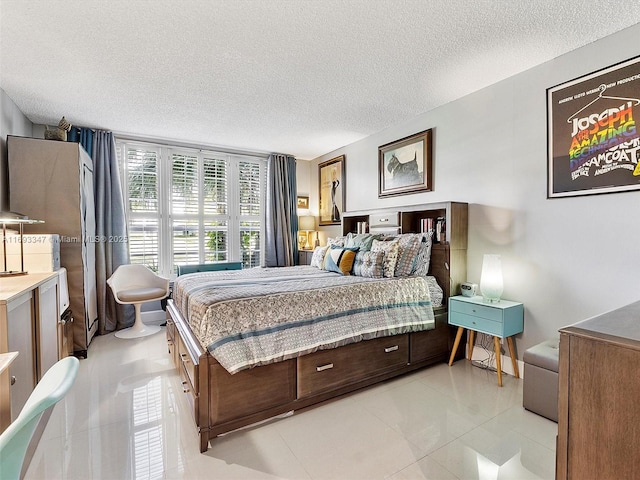 tiled bedroom featuring a textured ceiling