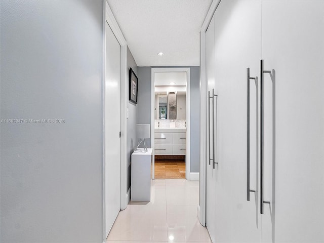 hall with light tile patterned flooring