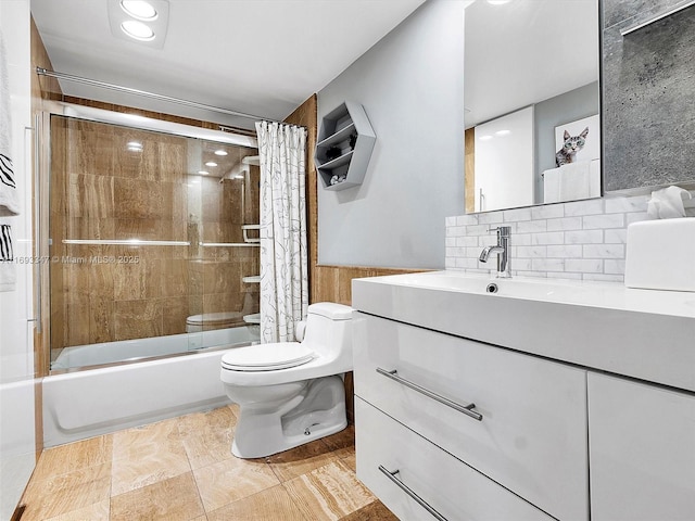 full bathroom featuring shower / bath combination with glass door, vanity, and toilet