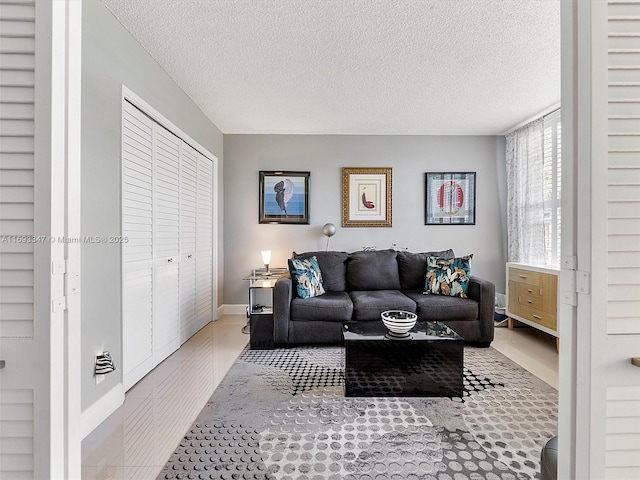 living room with a textured ceiling