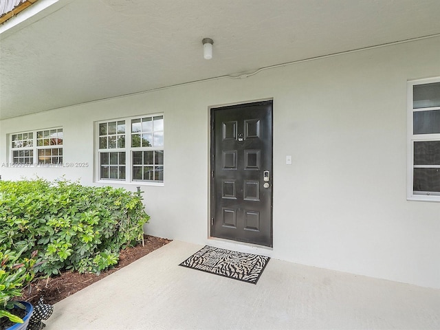 entrance to property with a patio area