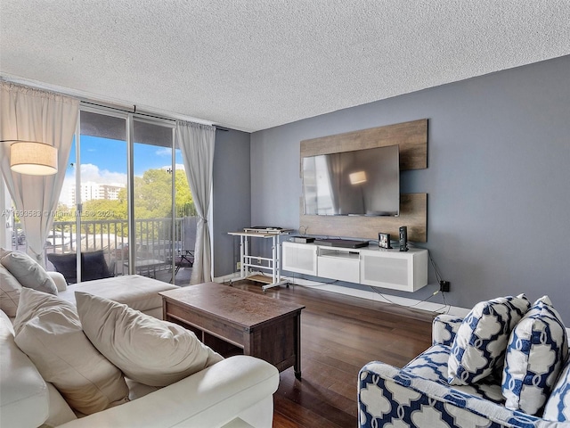 living room with hardwood / wood-style flooring and a textured ceiling