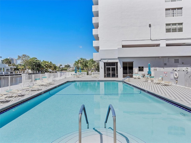 view of swimming pool featuring a patio area