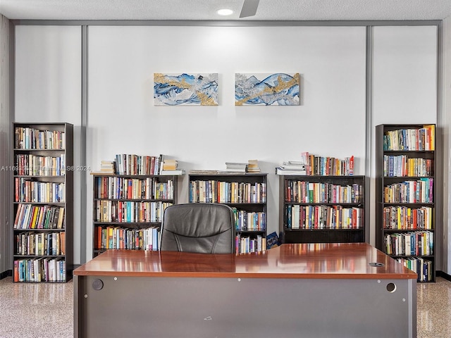 home office featuring a textured ceiling