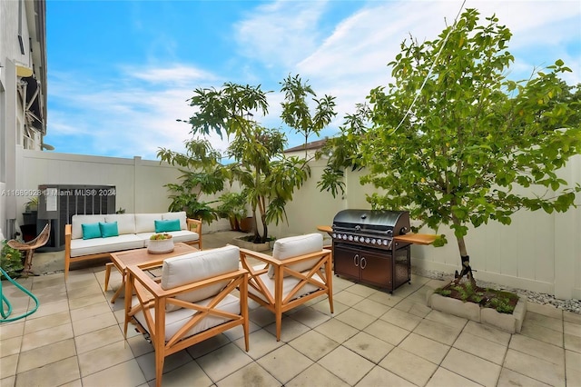 view of patio with an outdoor living space and grilling area