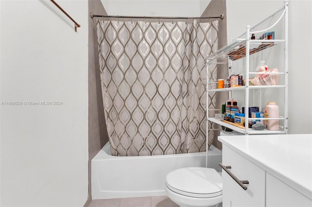 full bathroom featuring tile patterned flooring, vanity, toilet, and shower / bathtub combination with curtain