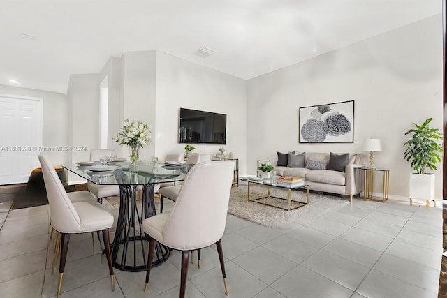 dining space with light tile patterned flooring