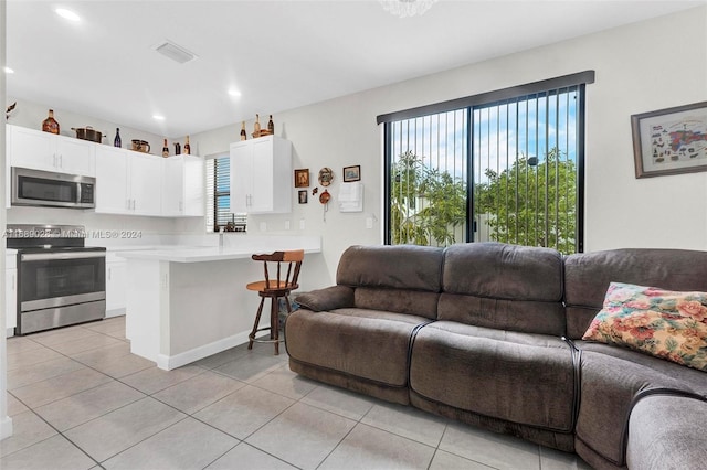 living room featuring light tile patterned flooring