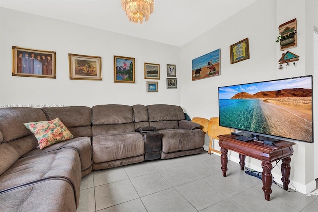 tiled living room featuring a notable chandelier