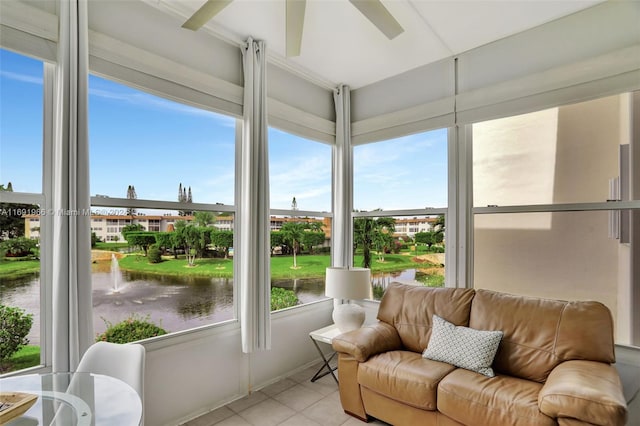 sunroom / solarium with a water view and plenty of natural light