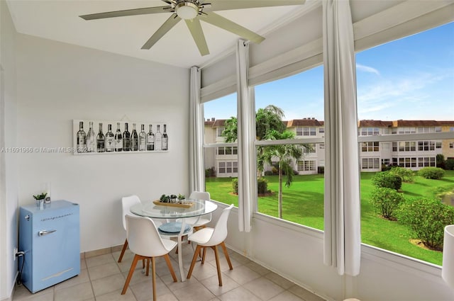 sunroom / solarium with ceiling fan