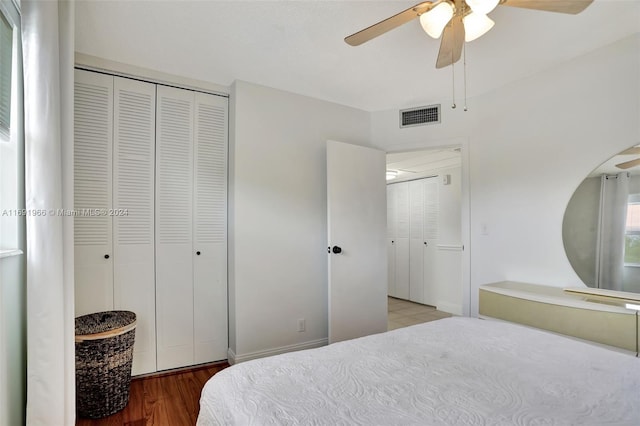 bedroom with wood-type flooring and ceiling fan