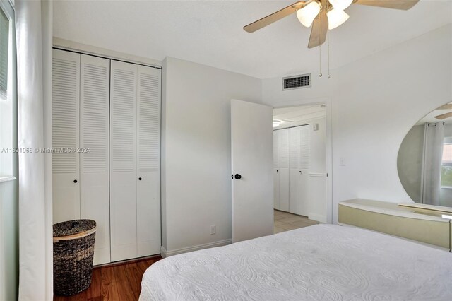 3501 NW 47th Ave Unit 504, Lauderdale Lakes, FL 33319 - bedroom with a closet, wood finished floors, and a ceiling fan