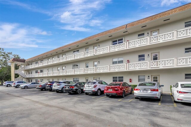 3501 NW 47th Ave Unit 504, Lauderdale Lakes, FL 33319 - view of property featuring uncovered parking