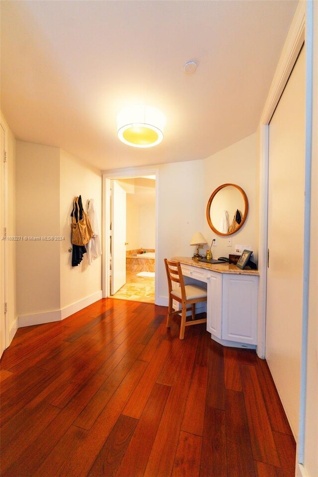 9595 Collins Ave Unit N9-C, Surfside, FL 33154 - corridor featuring dark wood-style flooring and a desk
