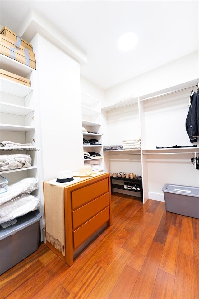 walk in closet featuring hardwood / wood-style flooring