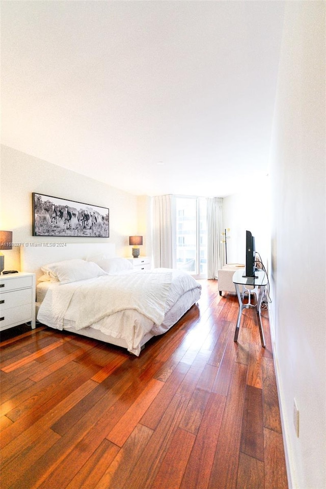 bedroom featuring hardwood / wood-style flooring