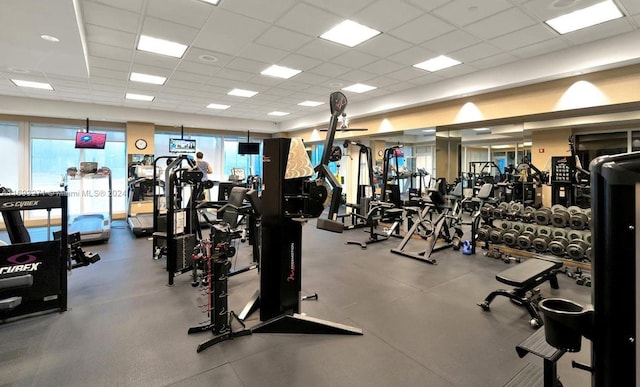 workout area with a paneled ceiling