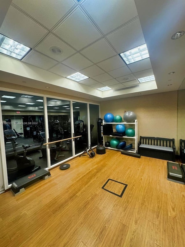 9595 Collins Ave Unit N9-C, Surfside, FL 33154 - exercise room with a paneled ceiling and wood finished floors