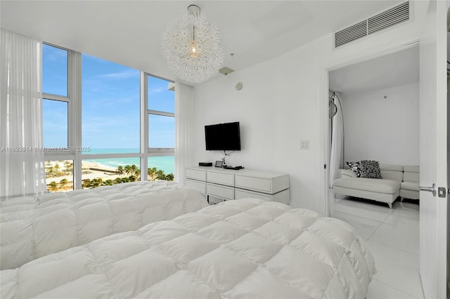 18201 Collins Ave Unit 1002, Sunny Isles Beach, FL 33160 - bedroom with a wall of windows and light tile patterned floors