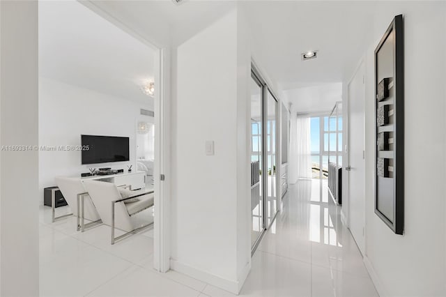 18201 Collins Ave Unit 1002, Sunny Isles Beach, FL 33160 - corridor featuring light tile patterned floors and baseboards