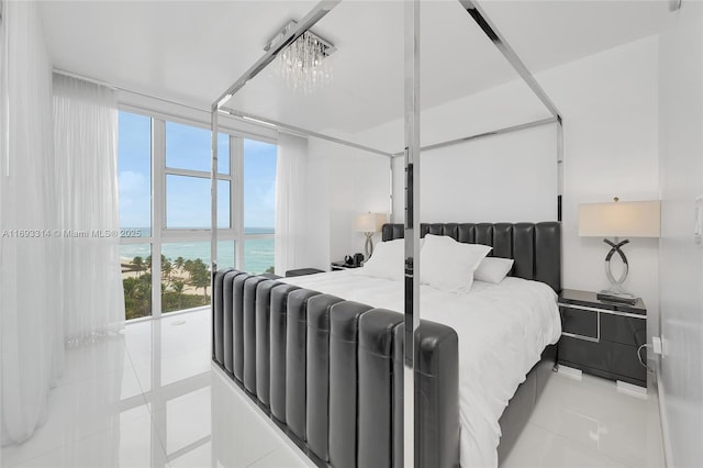18201 Collins Ave Unit 1002, Sunny Isles Beach, FL 33160 - bedroom featuring tile patterned floors and a water view