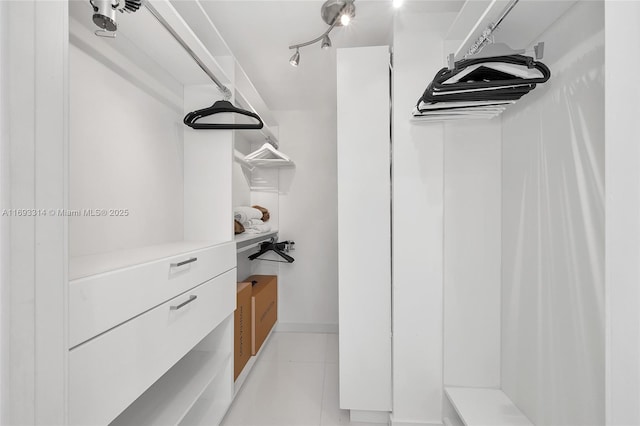 18201 Collins Ave Unit 1002, Sunny Isles Beach, FL 33160 - walk in closet featuring light tile patterned floors