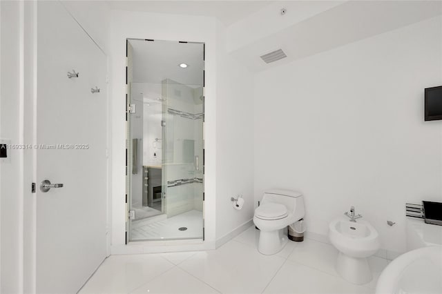 18201 Collins Ave Unit 1002, Sunny Isles Beach, FL 33160 - bathroom featuring a shower stall, a bidet, and tile patterned flooring