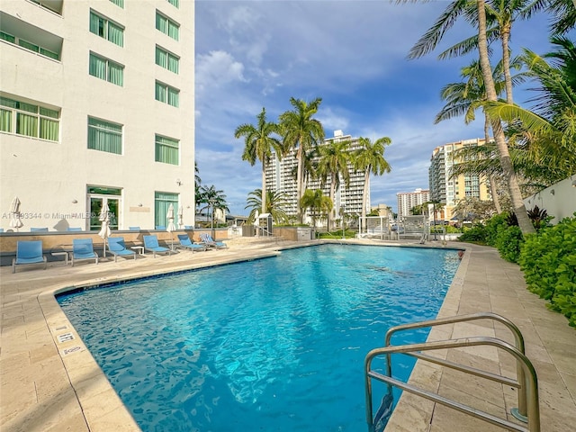 view of swimming pool with a patio