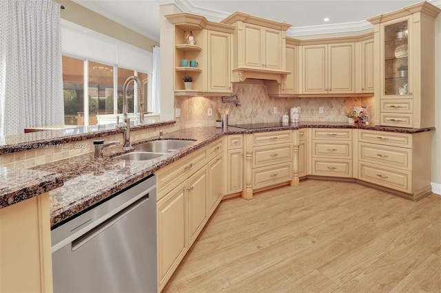 kitchen featuring sink, stainless steel dishwasher, crown molding, decorative backsplash, and light wood-type flooring