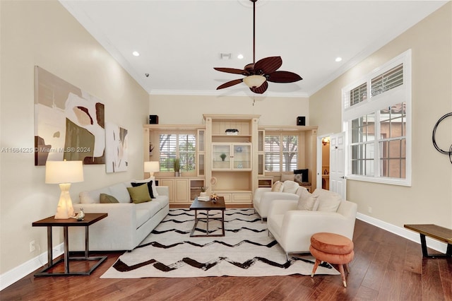 living room with ornamental molding, ceiling fan, and hardwood / wood-style flooring