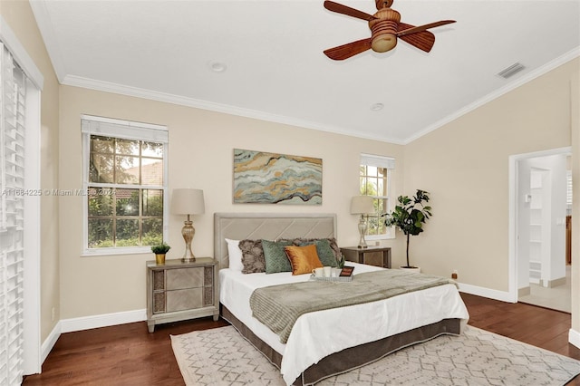 bedroom with dark hardwood / wood-style flooring, multiple windows, and ceiling fan