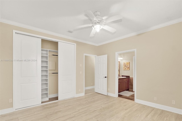 unfurnished bedroom featuring light wood-type flooring, ceiling fan, ornamental molding, and connected bathroom